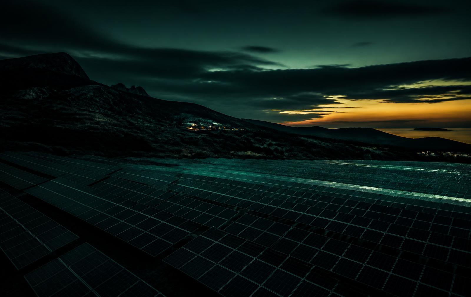 Commercial solar photovoltaic array at dusk